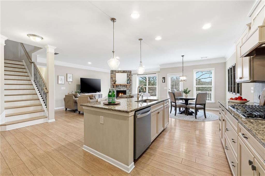 4735 Shiloh Valley Road Cumming, GA 30040 - Photo 8 of 39 a kitchen with stainless steel appliances granite countertop a stove and a wooden floors