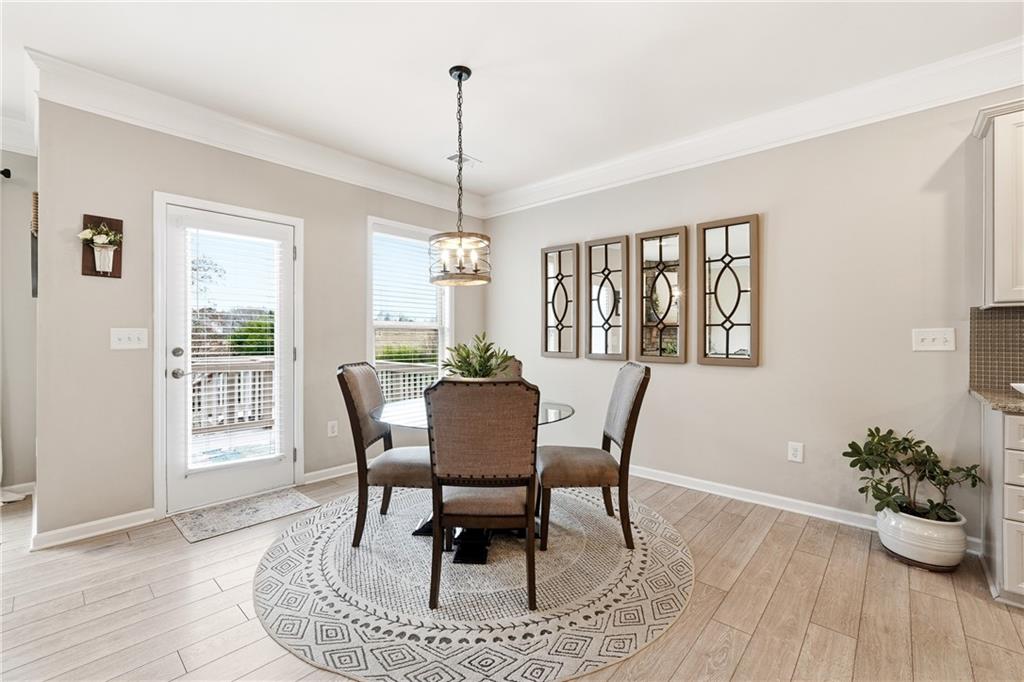 4735 Shiloh Valley Road Cumming, GA 30040 - Photo 9 of 39 a view of a dining room with furniture window and wooden floor