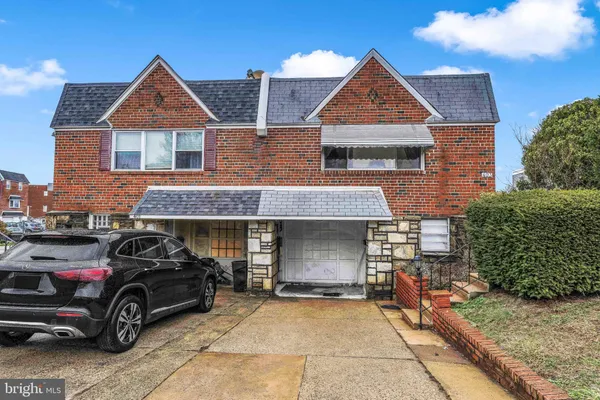 a view of a car parked in front of a house