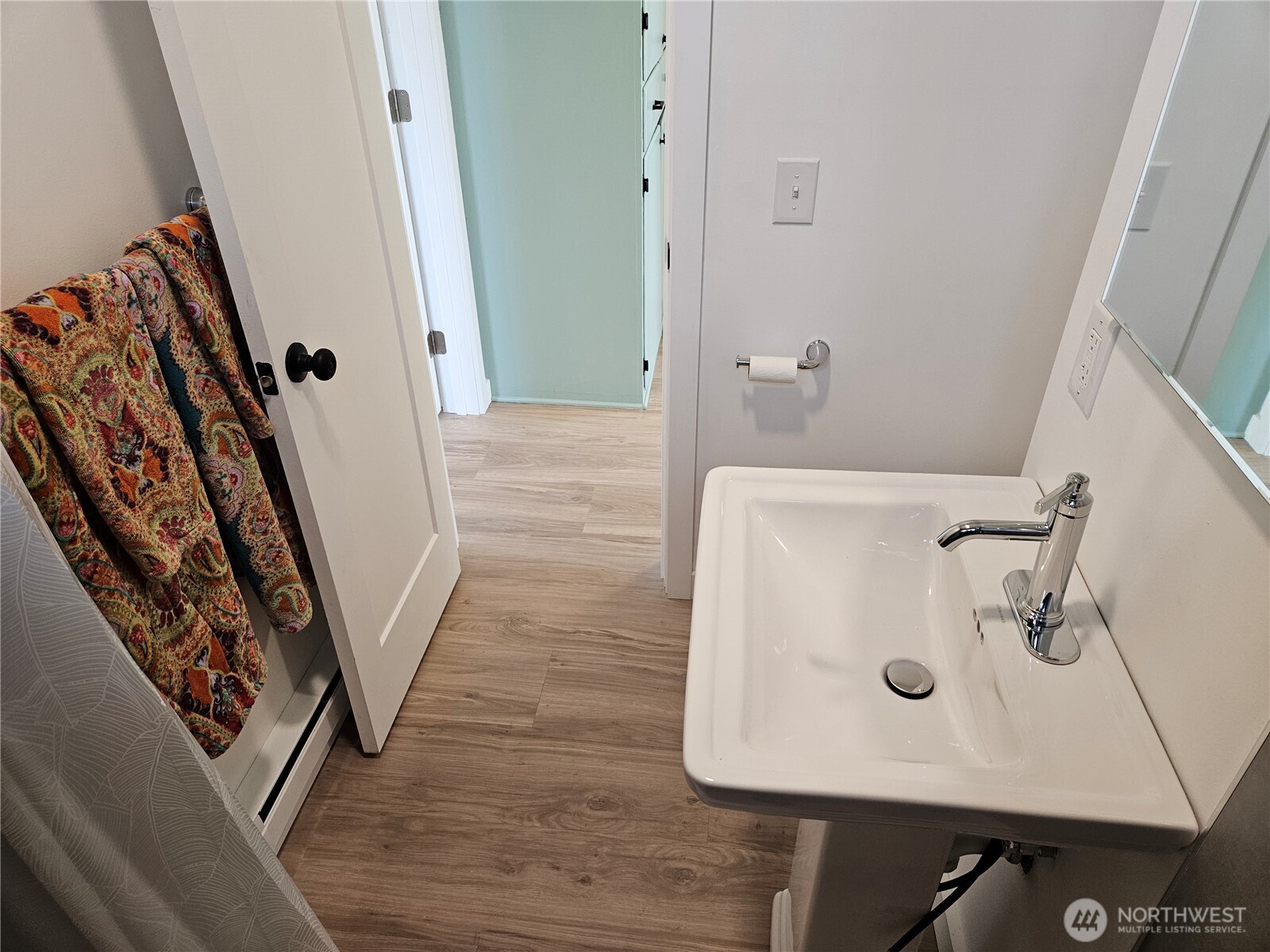 108 West 3rd Street Lind, WA 99341 - Photo 23 of 29 a bathroom with a sink and mirror