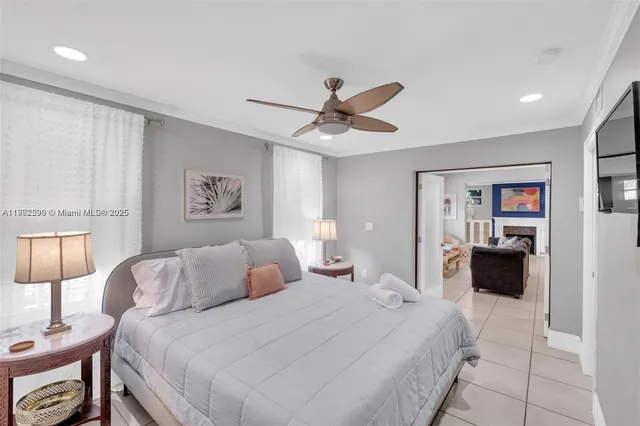 a bedroom with a bed and a lamp