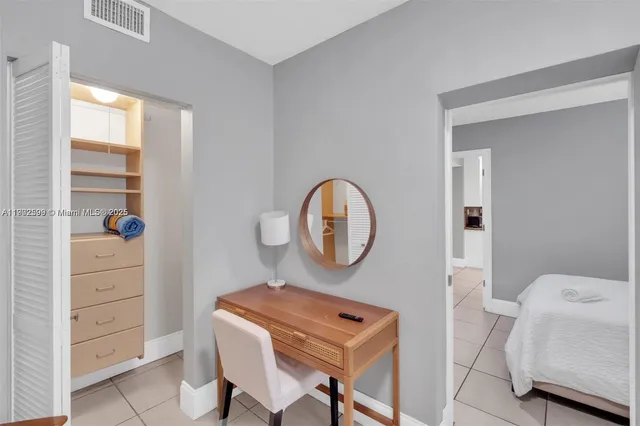 a view of room with furniture and wooden floor