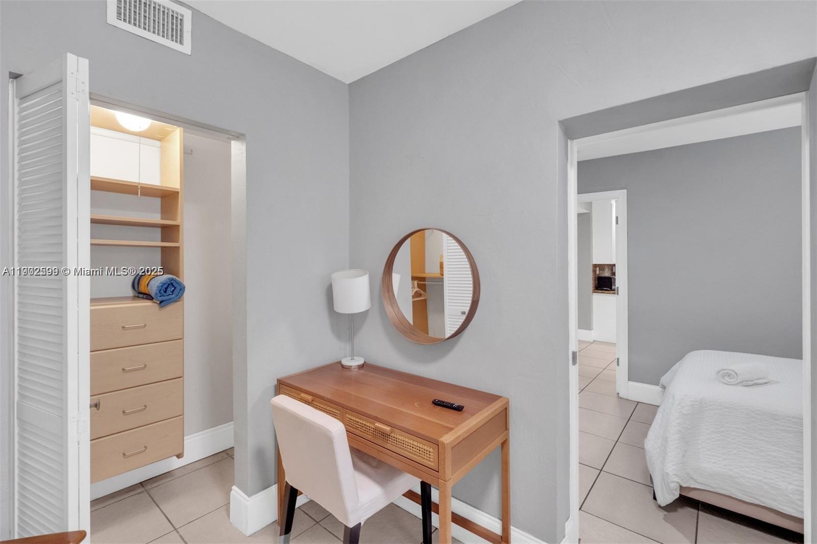 1033 Northwest 6 Street, Unit A Miami, FL 33136 - Photo 21 of 35 a view of room with furniture and wooden floor