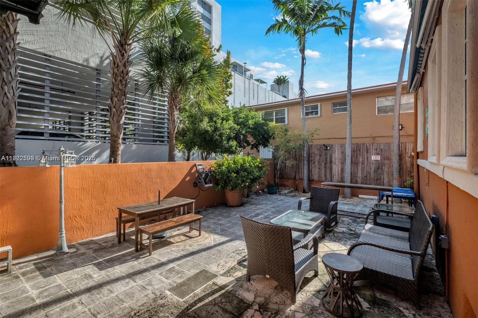 1033 Northwest 6 Street, Unit A Miami, FL 33136 - Photo 28 of 35 a backyard of a house with outdoor seating