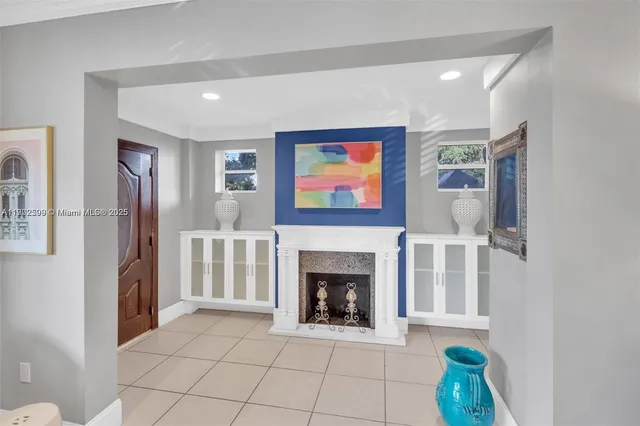 a view of an empty room with a fireplace