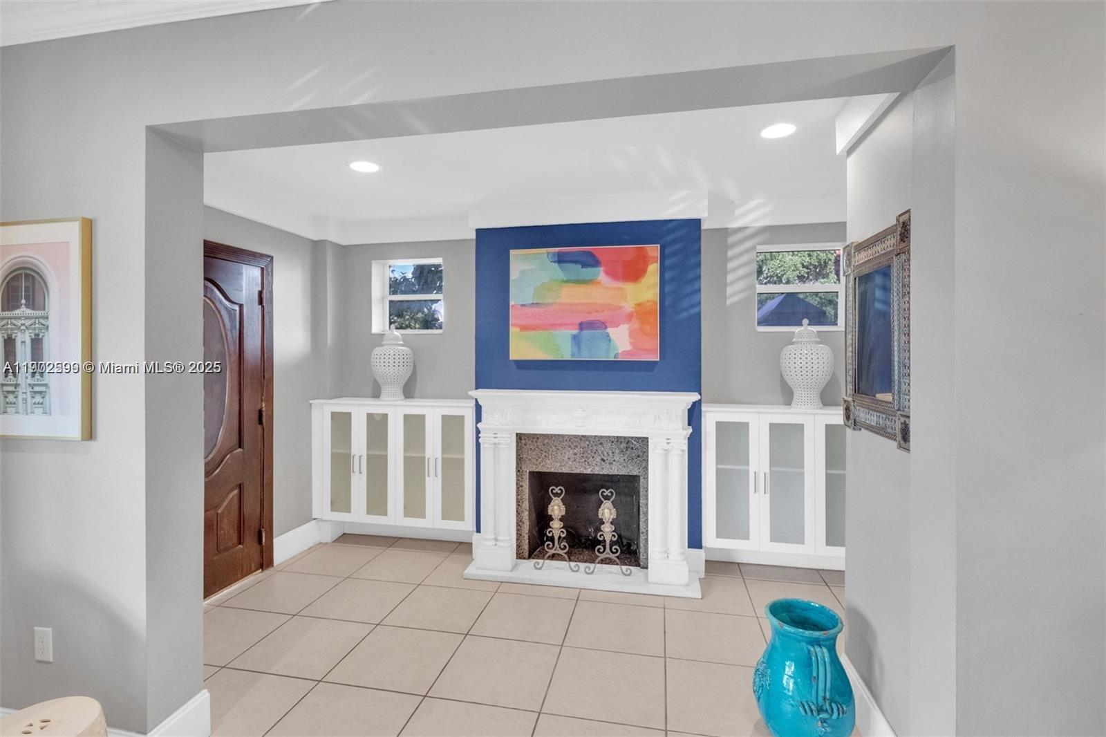 1033 Northwest 6 Street, Unit A Miami, FL 33136 - Photo 6 of 35 a view of an empty room with a fireplace