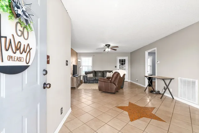 a living room with furniture and a table
