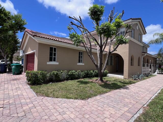 13922 Southwest 278th Street Homestead, FL 33032 - Photo 11 of 133 a front view of a house with garden