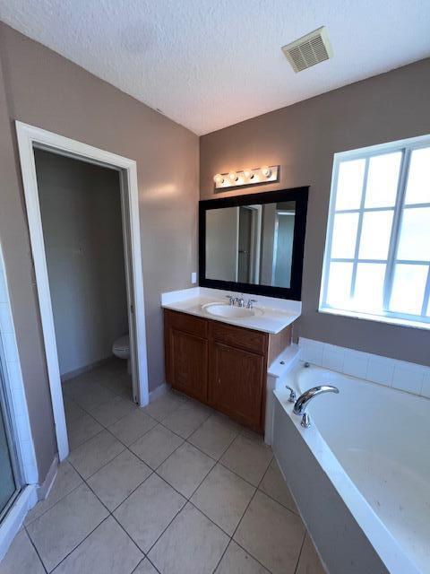 13922 Southwest 278th Street Homestead, FL 33032 - Photo 117 of 133 a bathroom with a bathtub sink and mirror