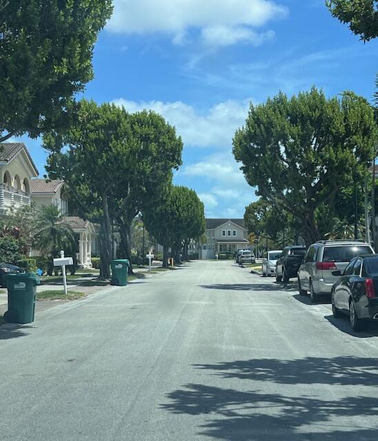 13922 Southwest 278th Street Homestead, FL 33032 - Photo 130 of 133 a view of street with parked cars