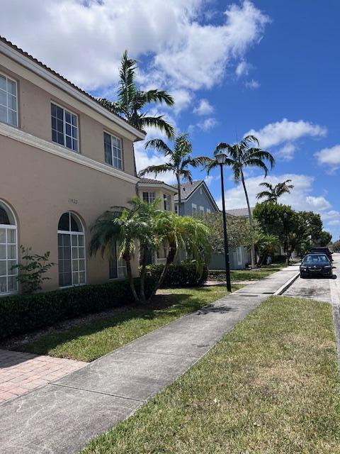 13922 Southwest 278th Street Homestead, FL 33032 - Photo 5 of 133 a front view of a house with a yard and a garage