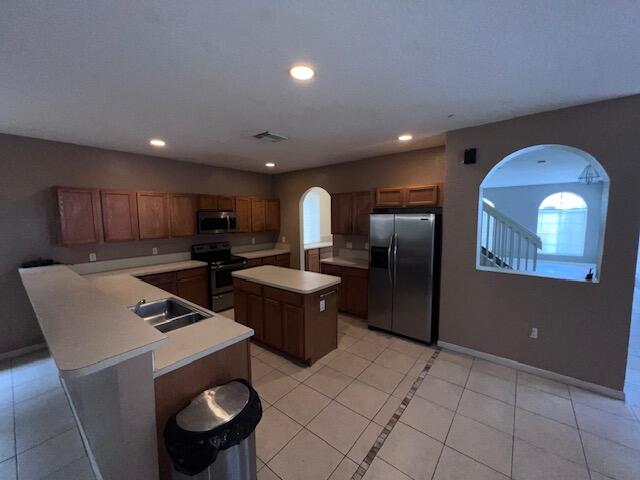 13922 Southwest 278th Street Homestead, FL 33032 - Photo 61 of 133 a kitchen with stainless steel appliances granite countertop a sink a stove a refrigerator and a microwave
