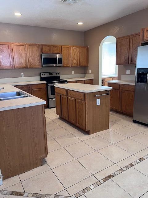 13922 Southwest 278th Street Homestead, FL 33032 - Photo 82 of 133 a kitchen with stainless steel appliances granite countertop a stove a sink a microwave and a refrigerator
