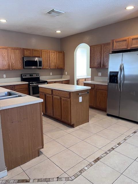 13922 Southwest 278th Street Homestead, FL 33032 - Photo 83 of 133 a large kitchen with cabinets and stainless steel appliances