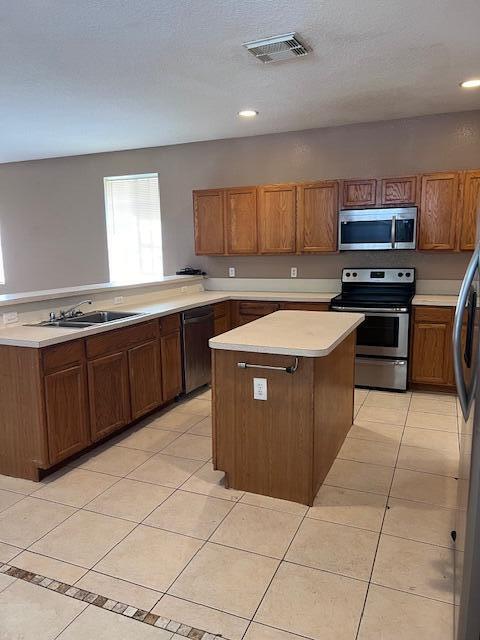 13922 Southwest 278th Street Homestead, FL 33032 - Photo 84 of 133 a kitchen with stainless steel appliances granite countertop a stove a sink and a microwave