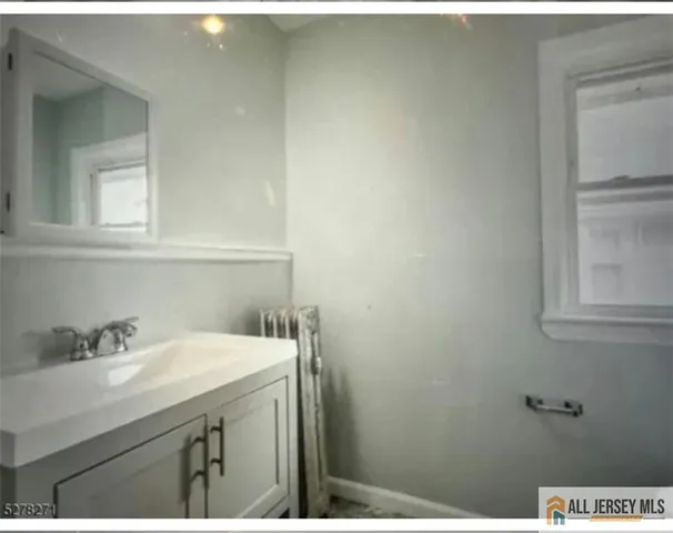 a bathroom with a sink and a vanity