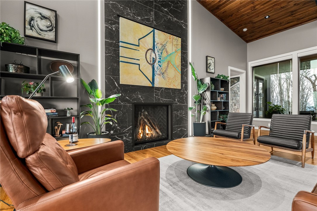 2623 Alum Cave Road Bee Branch, AR 72013 - Photo 12 of 60 Living area featuring a striking floor-to-ceiling black marble-effect fireplace with a visible firebox