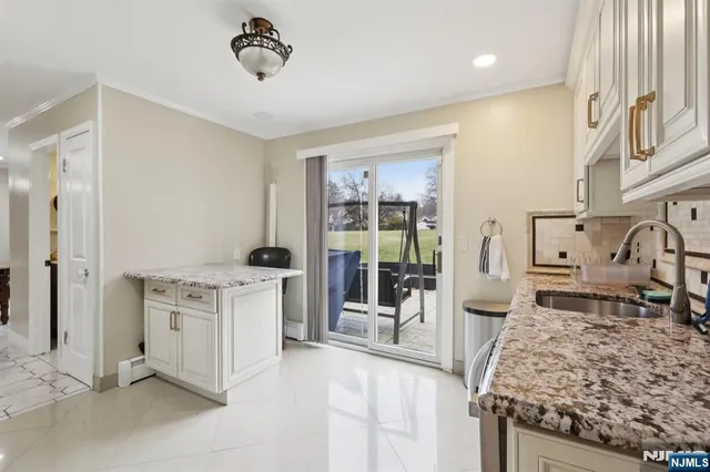 a kitchen with a stove and a refrigerator