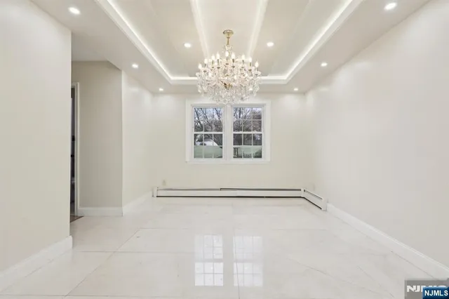 a view of a chandelier in an empty room