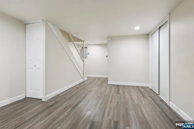 a view of hallway with wooden floor