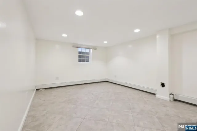 an empty room with a empty space and window