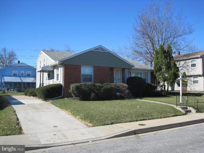 7905 Liberty Road Windsor Mill, MD 21244 - Photo 1 of 13 a front view of a house with a yard