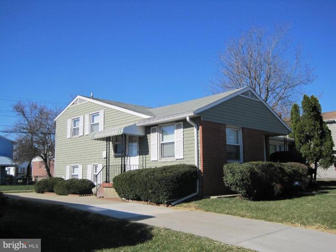7905 Liberty Road Windsor Mill, MD 21244 - Photo 2 of 13 a front view of a house with a yard