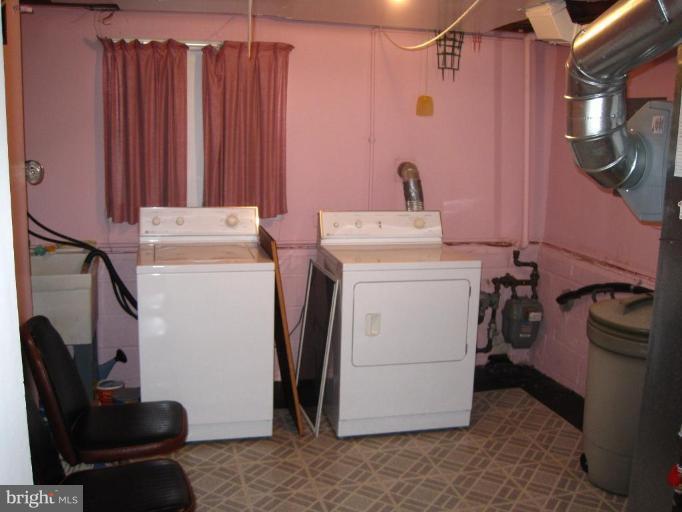 7905 Liberty Road Windsor Mill, MD 21244 - Photo 12 of 13 a utility room with dryer and washer