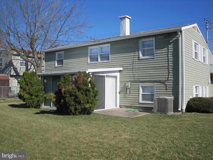 7905 Liberty Road Windsor Mill, MD 21244 - Photo 3 of 13 a front view of a house with garden