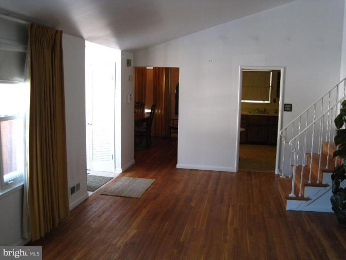 7905 Liberty Road Windsor Mill, MD 21244 - Photo 6 of 13 a view of hallway with wooden floor