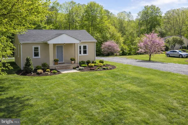 a aerial view of a house with swimming pool and porch