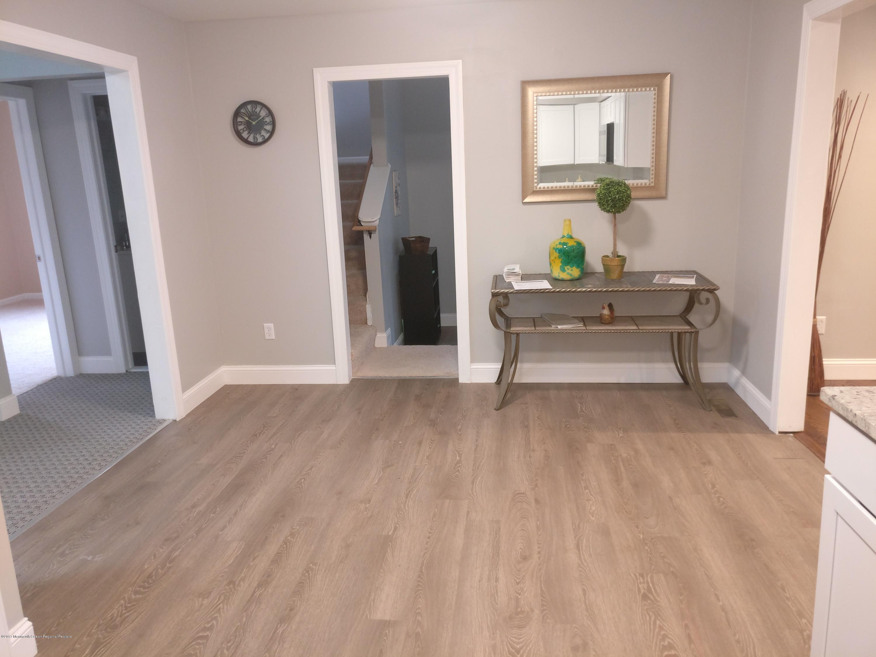 124 Launch Road Manahawkin, NJ 08050 - Photo 8 of 27 a view of living room with furniture and wooden floor