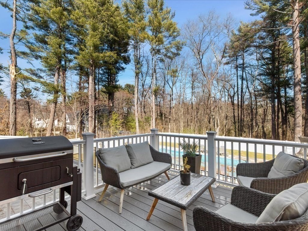5 Greenbriar Lane Bellingham, MA 02019 - Photo 22 of 26 a roof deck with couches and wooden floor