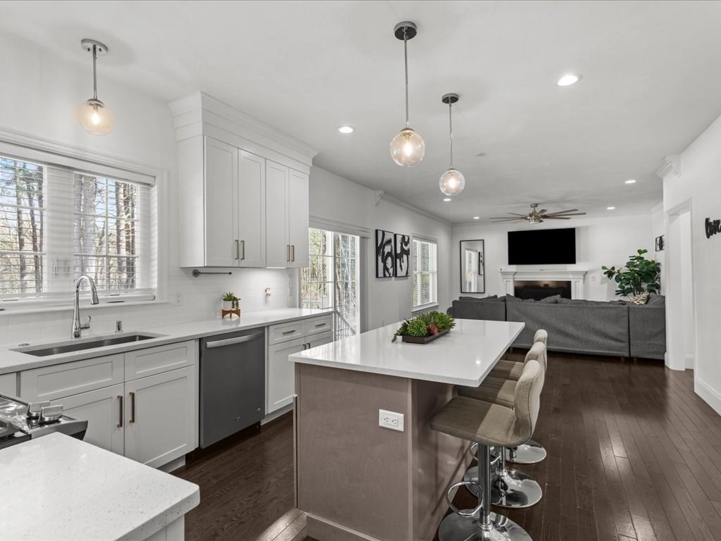 5 Greenbriar Lane Bellingham, MA 02019 - Photo 7 of 26 a open kitchen with sink cabinets and wooden floor