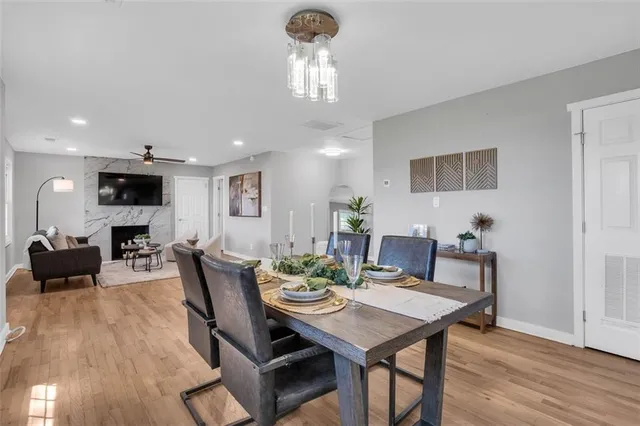 a view of a dining room with furniture and wooden floor
