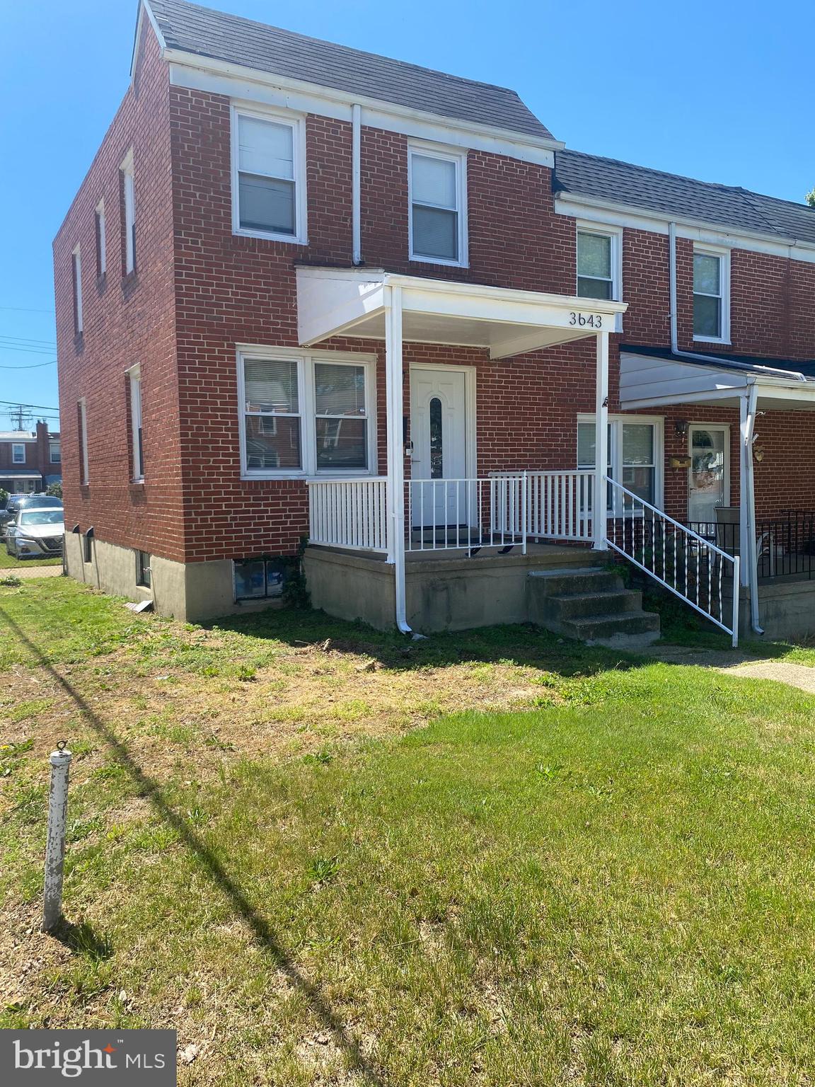 3643 Greenvale Road Baltimore, MD 21229 - Photo 22 of 23 a view of a brick house with many windows