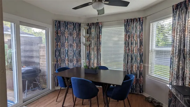 a dining room with furniture and window