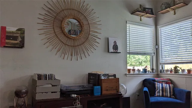 a view of a livingroom with furniture and window