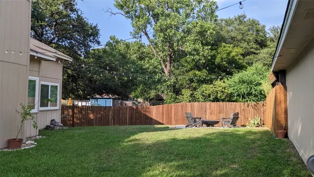 a view of a back yard with green space