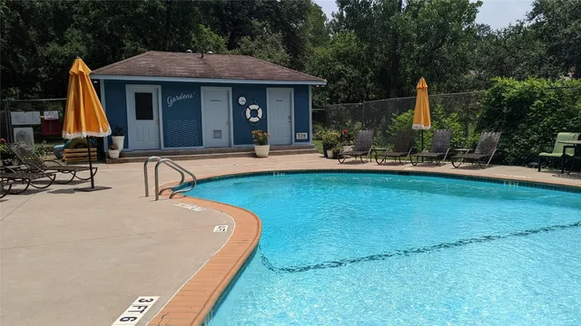 a view of a house with backyard porch and sitting area