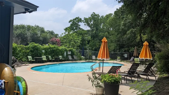 a view of a swimming pool with a patio