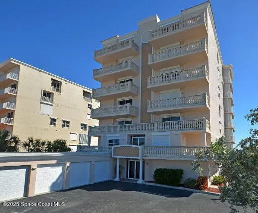 a front view of a building with large windows