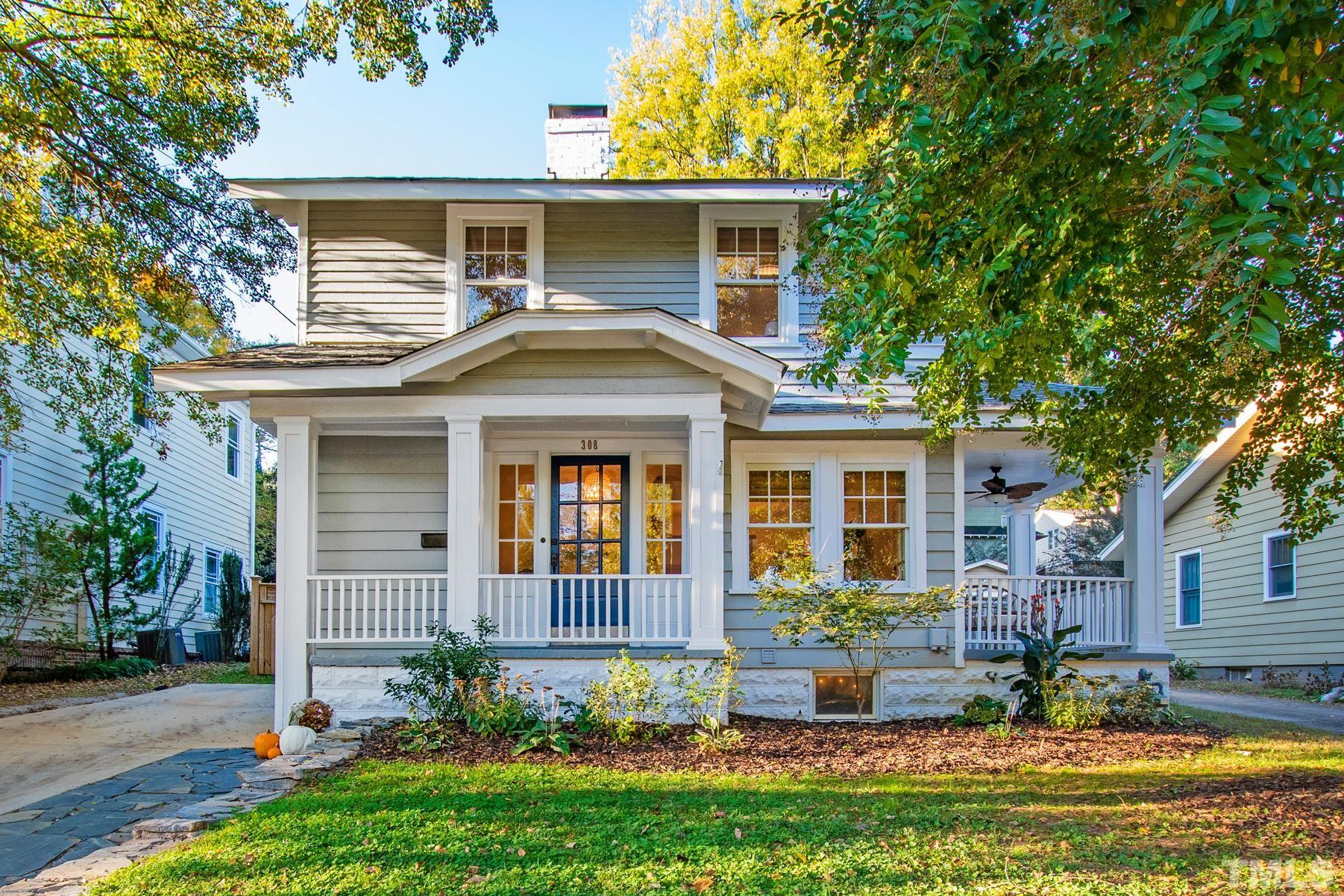 308 Perry Street Raleigh, NC 27608 - Photo 1 of 30 a front view of a house with a yard