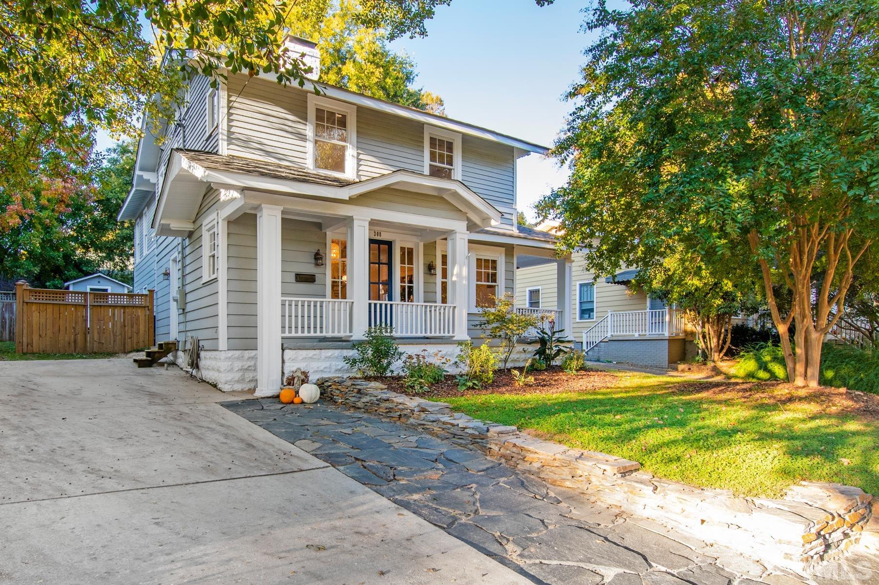 308 Perry Street Raleigh, NC 27608 - Photo 2 of 30 a front view of a house with a yard and garage