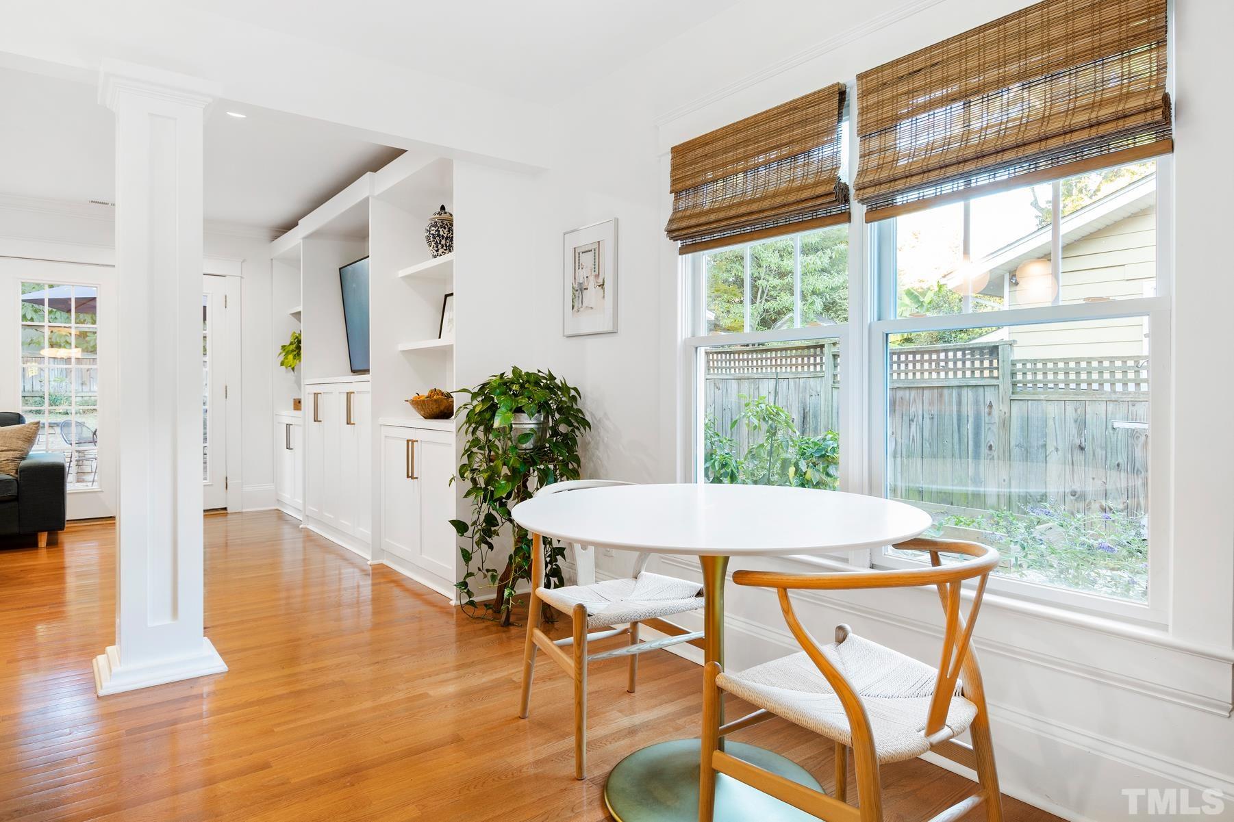 308 Perry Street Raleigh, NC 27608 - Photo 13 of 30 a view of a dining room with furniture window and wooden floor