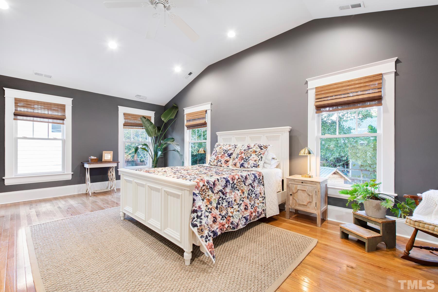 308 Perry Street Raleigh, NC 27608 - Photo 22 of 30 a bed room with a bed and windows