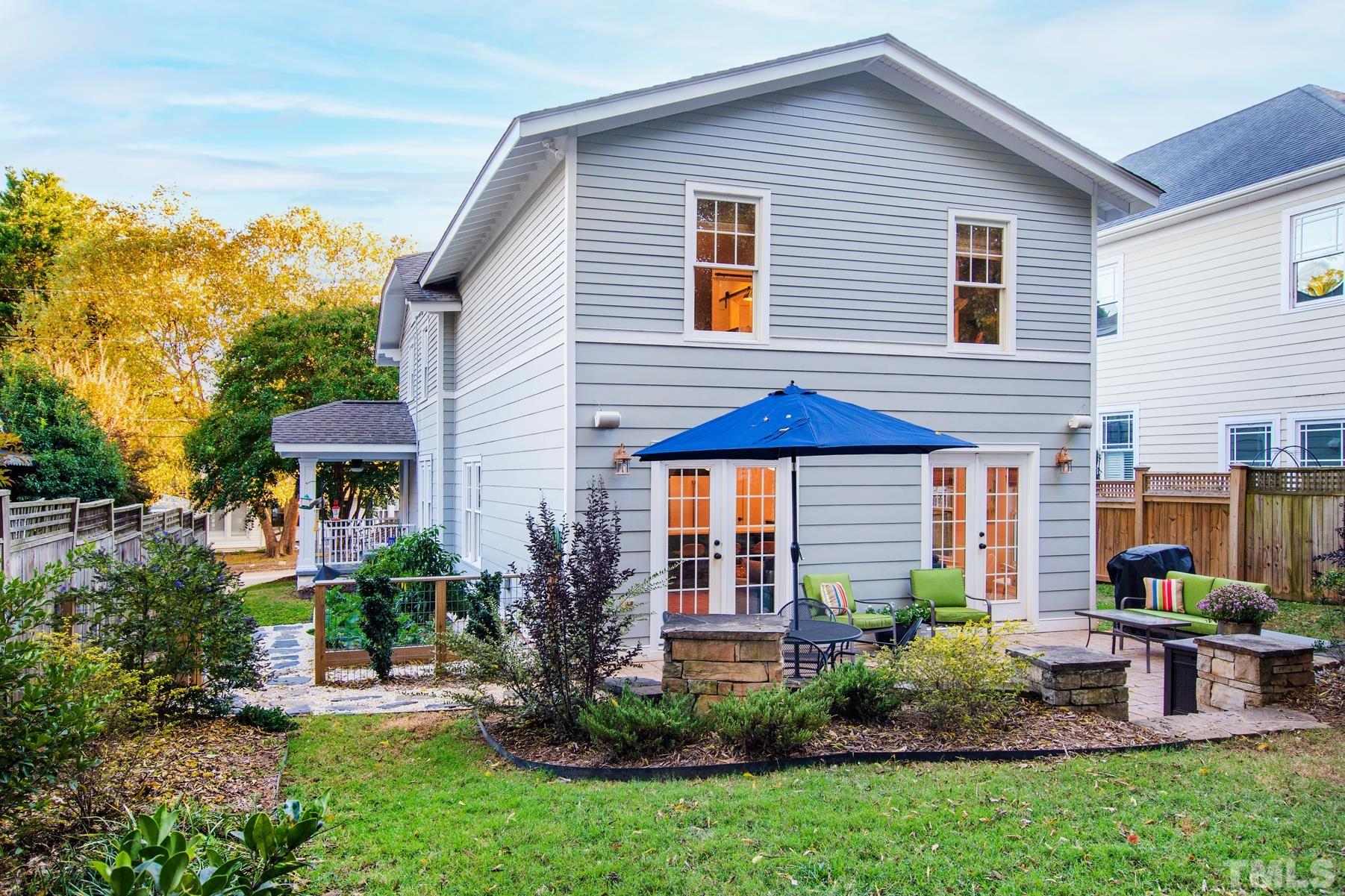 308 Perry Street Raleigh, NC 27608 - Photo 28 of 30 a view of a house with sitting area and garden