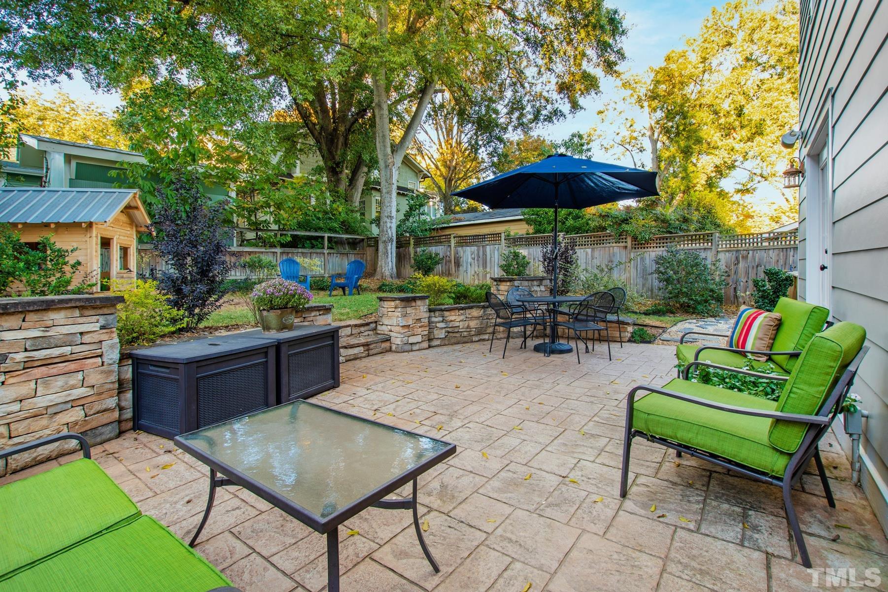 308 Perry Street Raleigh, NC 27608 - Photo 30 of 30 a view of yard with outdoor seating barbeque oven and trees
