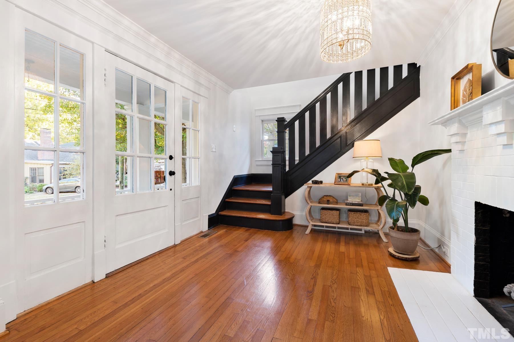 308 Perry Street Raleigh, NC 27608 - Photo 5 of 30 a living room with furniture and a wooden floor
