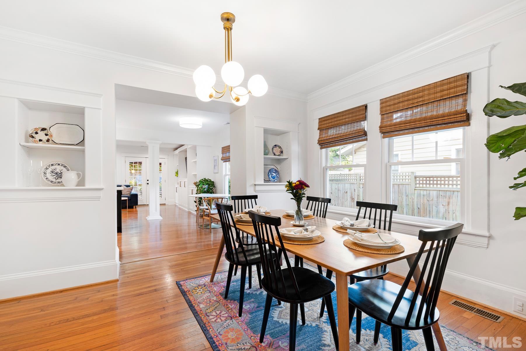 308 Perry Street Raleigh, NC 27608 - Photo 7 of 30 a view of a dining room with furniture window and wooden floor